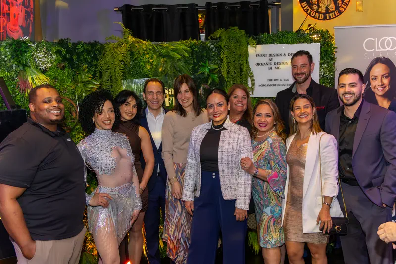 Guests at Salsa Flow & Networking 2026, together in front of the CLOO backdrop.